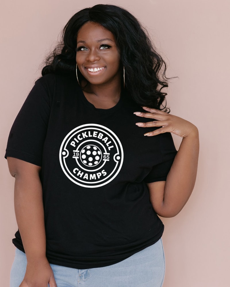 Front of a model wearing a size Large Pickleball Champs in Black by Simply Sage Market. | dia_product_style_image_id:281404